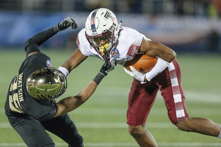 Temple's Ventell Bryant gets a 7 yard gain before Wake Forest's Brad Watson stopped him during the 4th quarter of the Military Bowl at the Navy-Marine Corps Memorial Stadium in Annapolis MD, Tuesday, December 27, 2016. Wake Forest beats Temple 34-26 to win the Military Bowl. STEVEN M. FALK / Staff Photographer