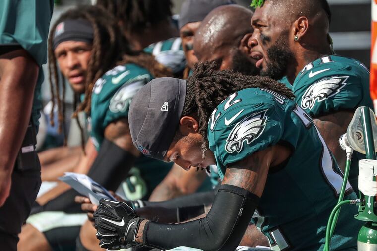 Eagles cornerback Sidney Jones, right, hangs his head on the bench after the Eagle defense aloowed the Titians to come back in the fourth quarter of the game on Sunday. The Eagles lost to the Tennessee Titans at Nashville on Sunday September 30, 2018, 26-23, in overtime. . MICHAEL BRYANT / Staff Photographer