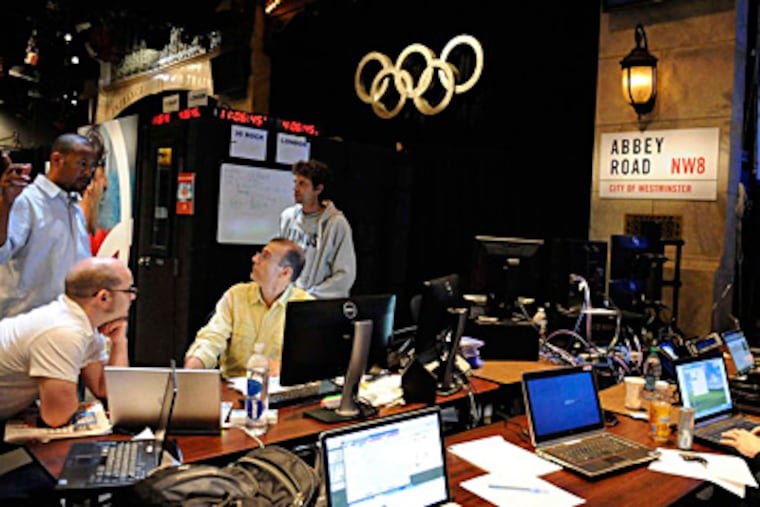 At the converted "Saturday Night Live" studio in New York, NBCUniversal employees create Olympics highlight clips and call competition in sports such as badminton, archery, and handball. VIRGINIA SHERWOOD / NBC