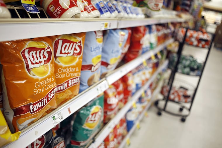 Chips and dips are displayed for sale at a grocery store in Louisville, Ky., in 2019.