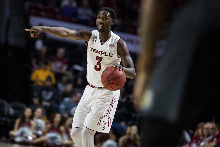 Junior guard Shizz Alston Jr. points to a teammate during the Owls' game against UCF at The Liacouras Center on Sunday, February 25, 2018. SYDNEY SCHAEFER / Staff Photographer