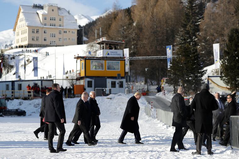 US President Donald Trump, center, arrives in Davos, Switzerland on Marine One, Tuesday, Jan. 21, 2020. President Trump arrived in Switzerland on Tuesday to start a two-day visit to the World Economic Forum.