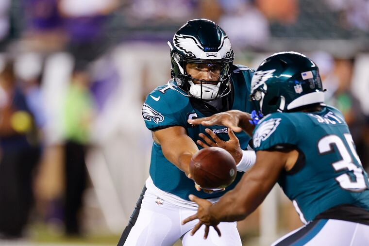 Philadelphia Eagles quarterback Jalen Hurts (1) hands it to Philadelphia Eagles running back Boston Scott (35) during warm ups before the game against Minnesota Vikings at Lincoln Financial Field on Monday, September 19, 2022.