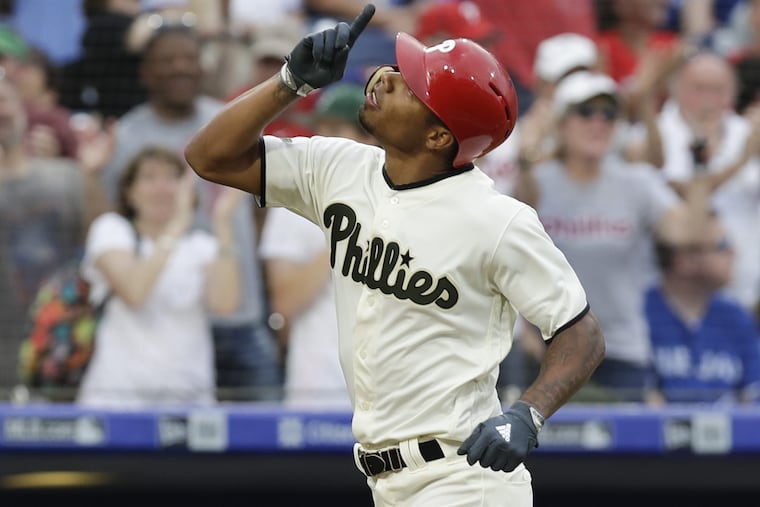 Phillies outfielder Nick Williams points to the sky after hitting a eighth-inning solo home run against the Toronto Blue Jays on Saturday.