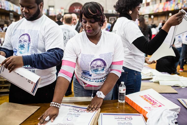 Kiea Wilcox prepares supply carriers at Girard College for the 19th Annual Greater Philadelphia Martin Luther King, Jr. Day of Service in this file photo from 2018.