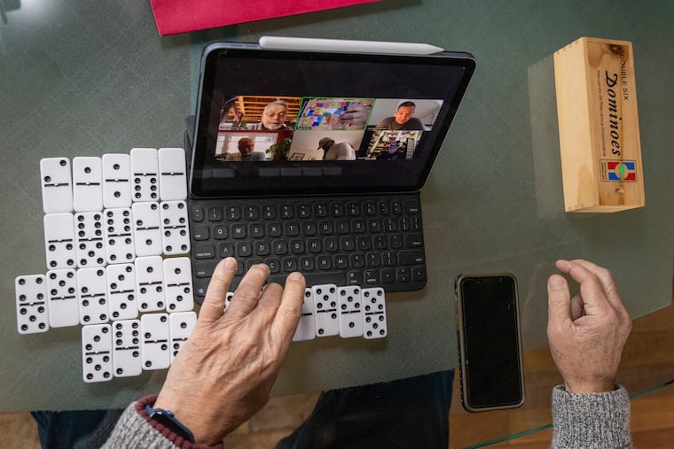 Former Philadelphia City Councilmember Angel Ortiz plays dominos via Zoom with friends around the country earlier this month.