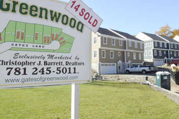 Townhouses are for sale at a new development in Wakefield, Mass. Sales of new homes dropped unexpectedly last month as the effects of a soon-to-expire tax credit for first-time owners started to wane, but senators agreed yesterday on a compromise to extend the credit. (Lisa Poole / Associated Press)