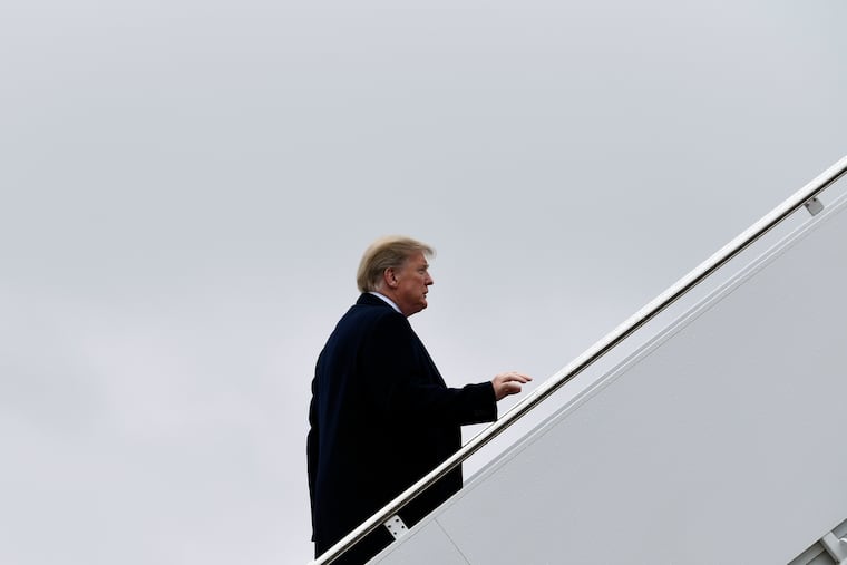 President Donald Trump walks up the steps of Air Force One at Andrews Air Force Base in Md., Monday, Feb. 11, 2019. Trump headed to El Paso, Texas, to try and turn the debate over a wall at the U.S.-Mexico border back to his political advantage.