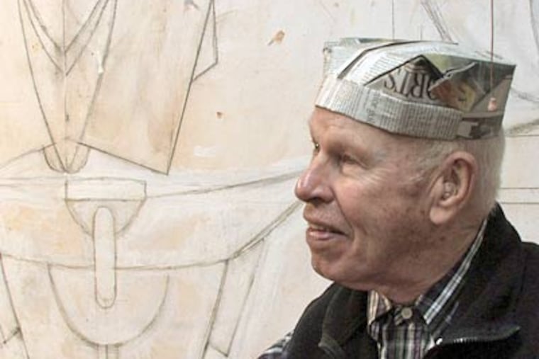 Bill Daley wears a newspaper hat he made. See a <a href="http://www.philly.com/philly/video/104220614.html"><b>video</b></a> of Daley demonstrating how to make the hat.