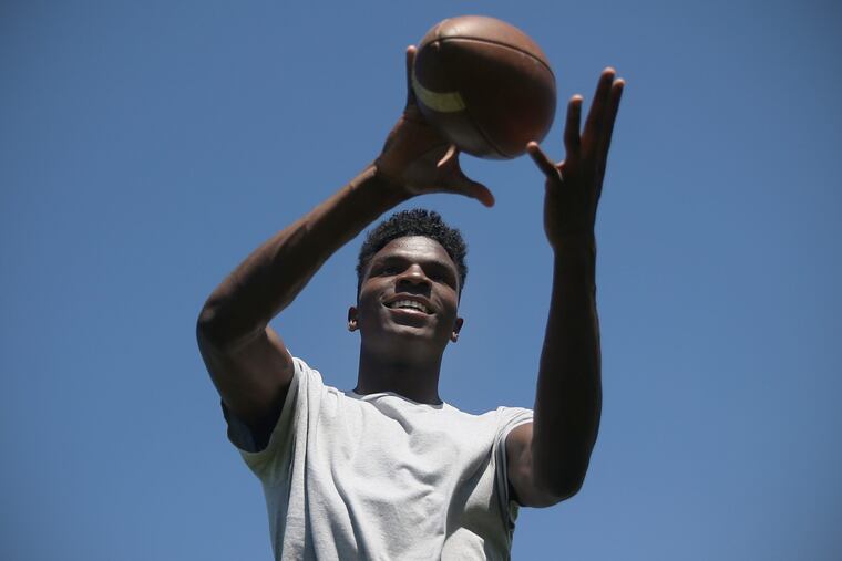 Wide receiver and rising senior Stanley King poses for a portrait on the football field at Woodrow Wilson High School in Camden, N.J., on Tuesday, June 12, 2018. TIM TAI / Staff Photographer