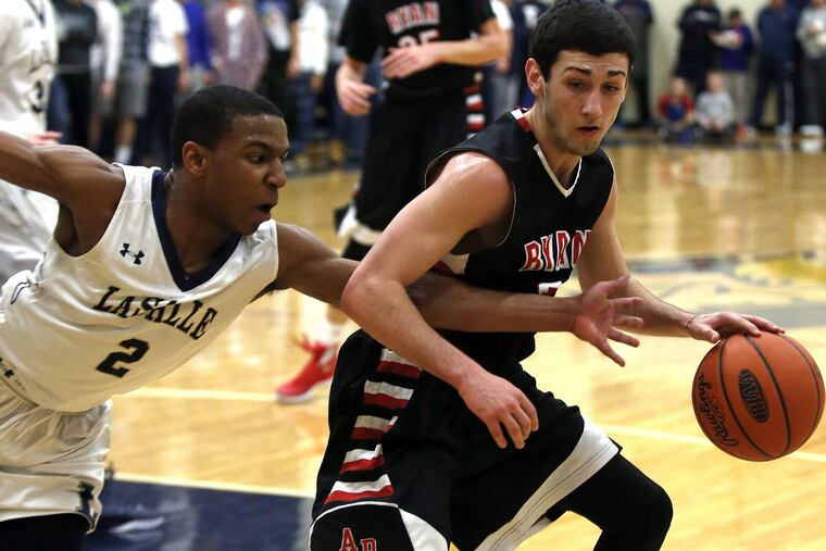 La Salle College High's Jarrod Stukes (left) fouls Archbishop Ryan
High's Austin Slawter during the second-quarter of the Catholic League boys' basketball quarterfinal game on Friday, February 12, 2016 at La Salle College High School. ( YONG KIM / Staff Photographer )