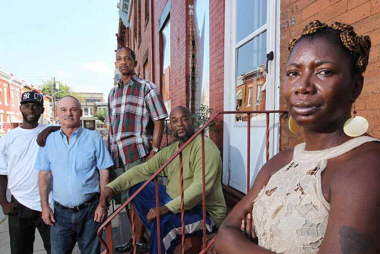 Letitia Mack (right) at the recovery house with residents (from left) Wilson Marrow, Gary Doughty, James Flowers, and Tony Haile. (Michael Bryant/Staff Photographer)