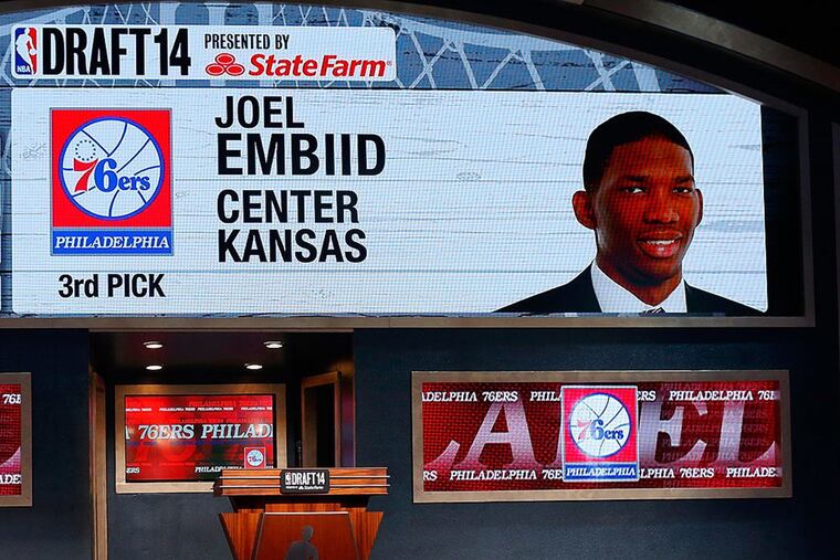 A video screen showed the selection of Joel Embiid of Kansas as the No. 3 overall pick in the first round by the 76ers during the 2014 NBA draft at Barclays Center on June 26, 2014 in Brooklyn.