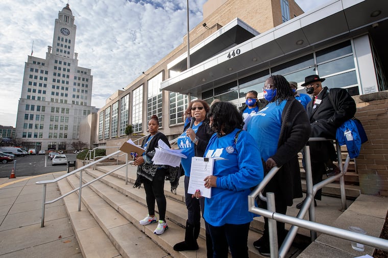 Parent Kristina Wilkerson speaks as Mastery parents rally on Thursday, protesting Philadelphia School District changes that would prohibit students who live outside school catchment areas from attending those schools - but only if they attend district schools run by charter companies like Mastery. Students in district-run schools can still attend schools outside their neighborhood if there's room for them.