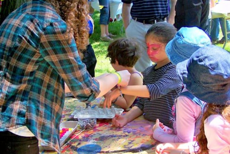 Children can have their faces painted at the Arts in the Park Festival in Elkins Park, one of many activities in addition to art and entertainment.