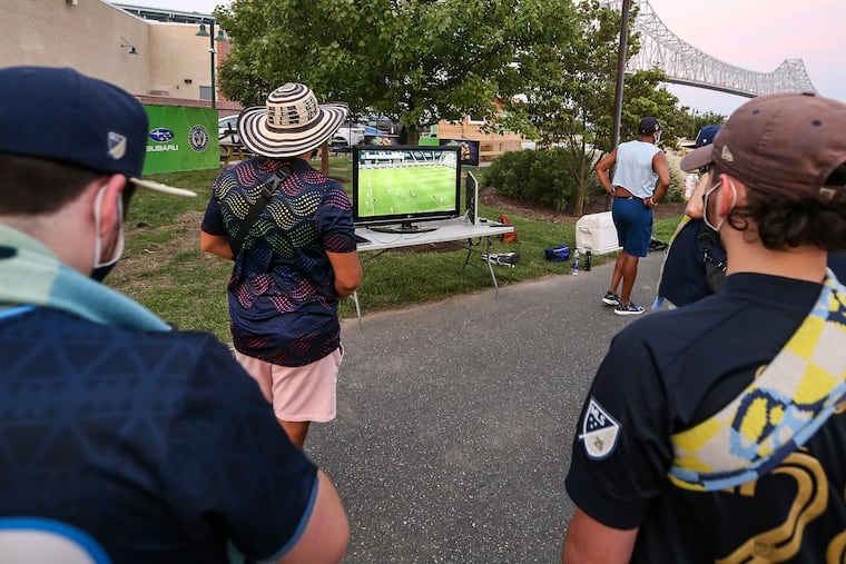 A small group of Union fans gathered outside Subaru Park to watch the Union-Red Bulls game on TV.
