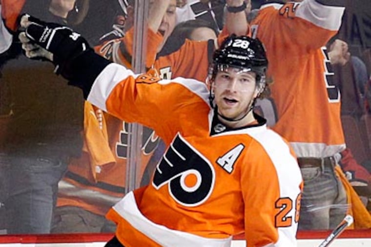 Claude Giroux celebrates after tying the game in the second period against the Capitals. (Yong Kim/Staff Photographer)