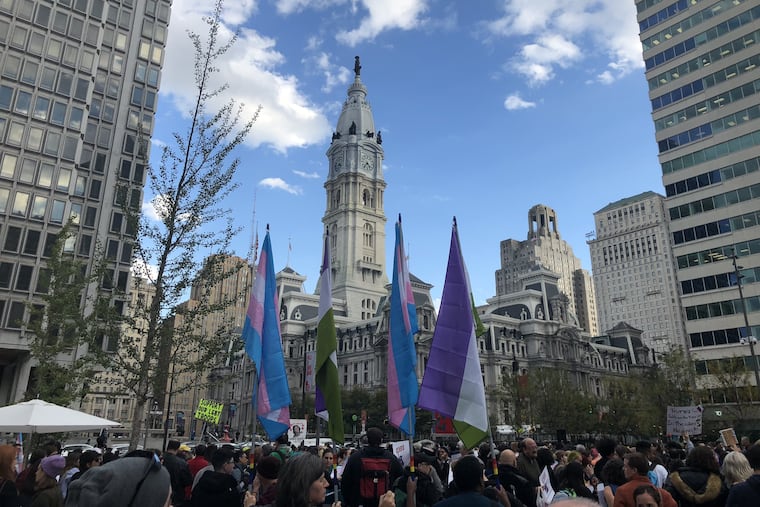 The crowd at the Rally for Trans Existence and Resistance in the shadow of City Hall