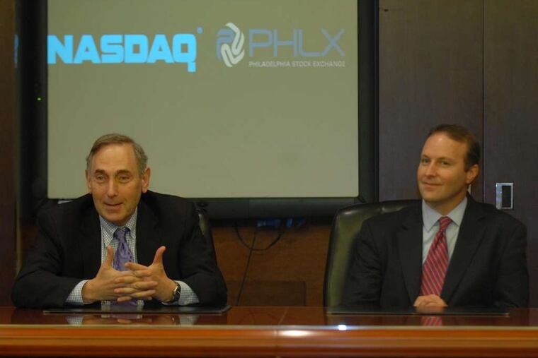 In 2007, executives Meyer "Sandy" Frucher (left) and Christopher Concannon discuss the sale.