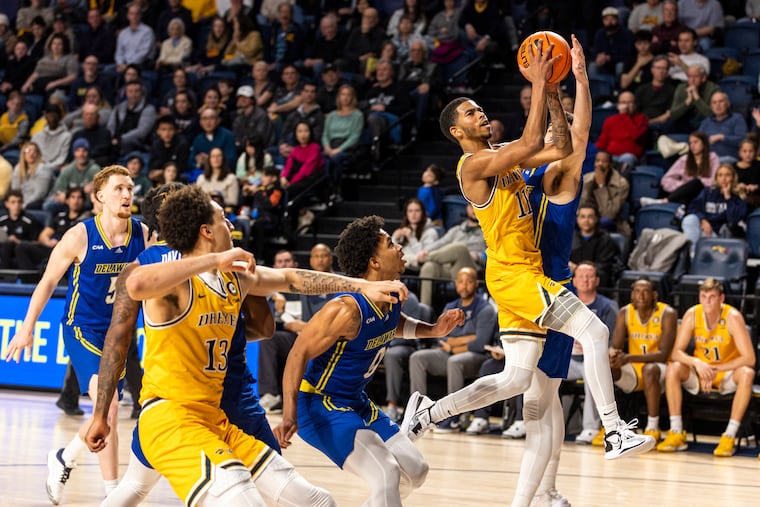 Drexel guard Justin Moore (11) led the Dragons with 21 points in an overtime win against Delaware at the Daskalaskis Athletic Center on Saturday.