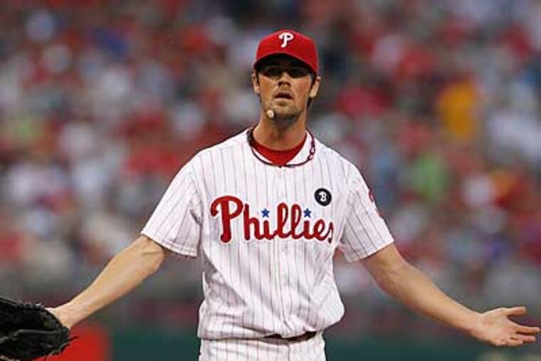 Cole Hamels allowed two runs on eight hits in eight innings. (Ron Cortes/Staff Photographer)