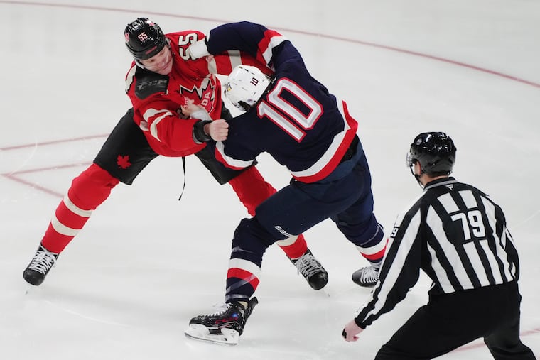 Canada's Colton Parayko (55) fights United States' J.T. Miller (10) during the first period 4 Nations Face-Off hockey action in Montreal on Saturday.