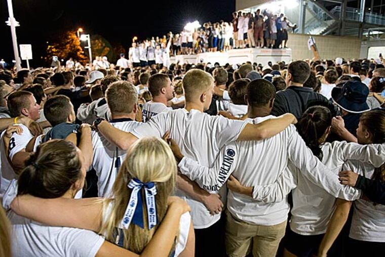 Thousands of students sing the Penn State Alma Mater outside Beaver Stadium.. (John Beale/AP)