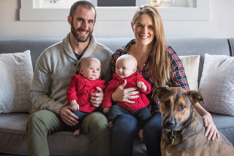 Brian (with Griffin) and Christy (with Graydon), with their dog, Denali, named for the mountain in Christy's home state of Alaska.