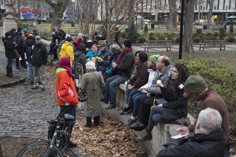 Rittenhouse Square Park lovers gather at lunchtime January 17, 2017 for the "Sittenhouse" event, which was originally going to be a protest against the recently posted “No Sitting on Walls” signs, but since they came down this morning, the event turned into a celebration.