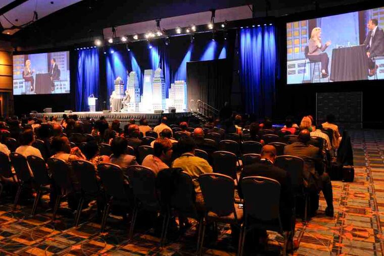 Participants watch the opening ceremony of the National Association of Black Journalists convention at the Convention Center. Story and another photograph, B4.