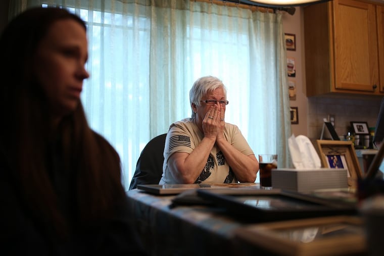 Pat Dickson, right, cries as she talks about her son, Bobby, who died in a heroin overdose in December 2017 in Kensington. With her is Courtney Bracken, the mother of Bobby’s son.