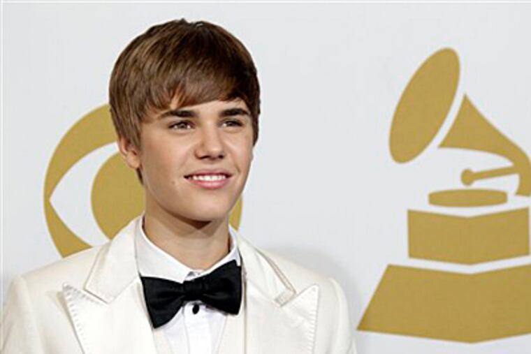 Justin Bieber poses backstage at the 53rd annual Grammy Awards on Sunday, Feb. 13, 2011, in Los Angeles. (AP Photo/Jae C. Hong)