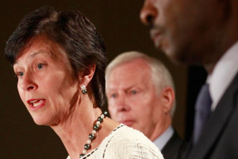 Karen Peetz, chairwoman of Penn State's board of trustees; Kenneth Frazier, right; and Penn State president Rodney Erickson during a news conference called in Scranton in response to the Freeh Report. DAVID SWANSON / Staff Photographer