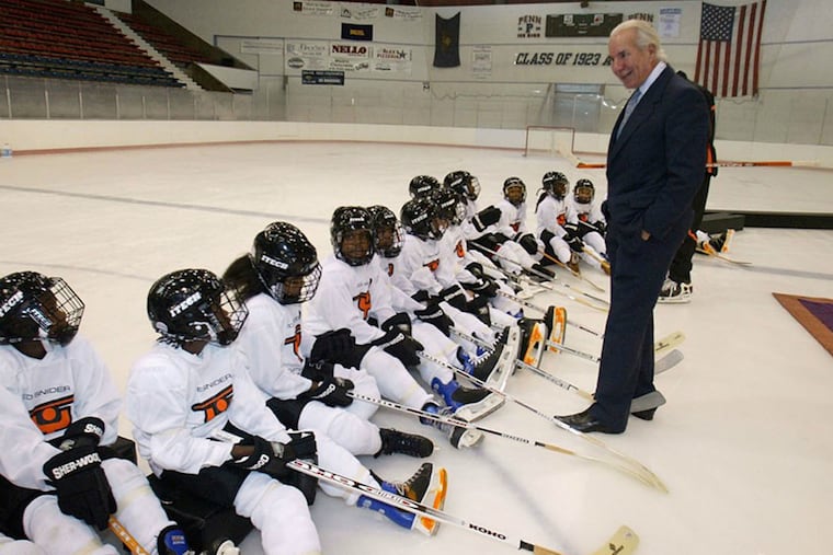 Ed Snider, shown here with youngsters at the Class of 1923 rink on the Penn campus in 2005, considered his youth hockey foundation to be his legacy.