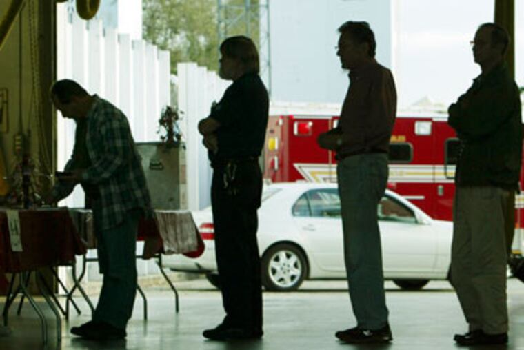 FILE - In this Jan. 29, 2008 file photo, voters line up at a polling station to vote in Florida's presidential primary in Coral Gables, Fla. A Florida commission is expected to announce Friday, Sept. 30, 2011, that its presidential primary will be held Jan. 31, according to Florida House Speaker Dean Cannon, though GOP officials from other states are lobbying Florida to reconsider. (AP Photo/Wilfredo Lee, File)