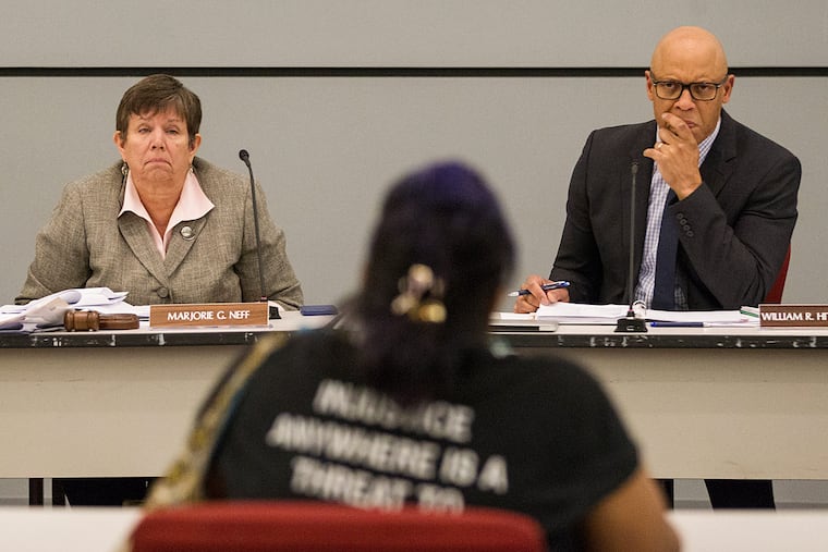 Majorie Neff and William Hite listen to public testimony.
