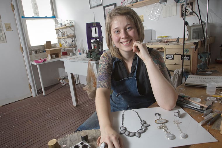 Nicolette Absil practices the ancient art of enameling, making hand-drawn botanical images in jewelry that she sets in sterling silver. ALEJANDRO A. ALVAREZ / Staff Photographer