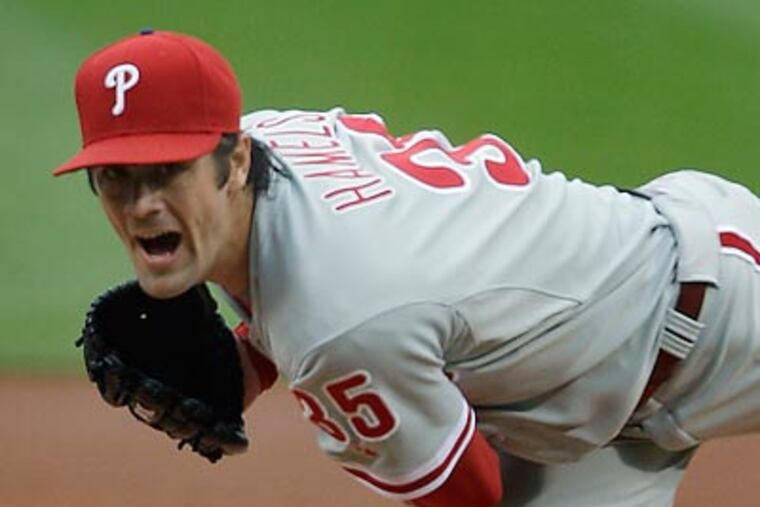 Cole Hamels allowed only one run in seven innings Sunday against the Red Sox. (Charles Krupa/AP)