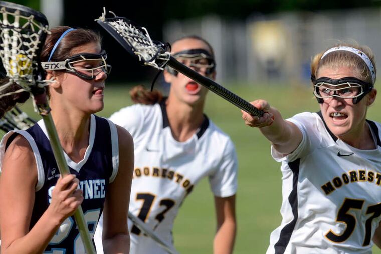 Moorestown's Steph Toy tries to block Katie Kernan. Toy scored five goals in the 19-8 victory.