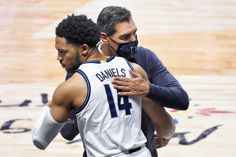 Villanova's Caleb Daniels is embraced by Villanova coach Jay Wright in November. Wright has big plans to Daniels.