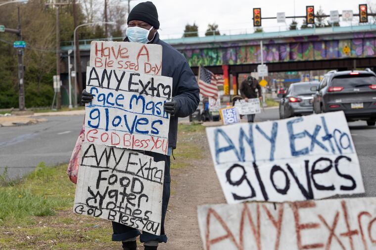 A man who wished to remain unidentified asked drivers for food and protective wear at the intersection of Penrose Ave. and 26th St. at the base of the Platt Bridge on Friday. He said he received mainly gloves and not many masks.