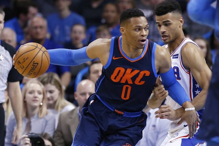 Thunder guard Russell Westbrook (left) drives around Sixers guard Timothe Luwawu-Cabarrot, during the Sixers’ loss on Sunday.