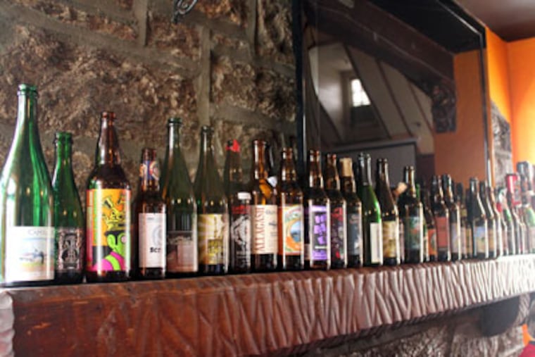 The Wet Whistle Bar mantle holds a distinguished row of empties. (Photo / Stephen Lyford)