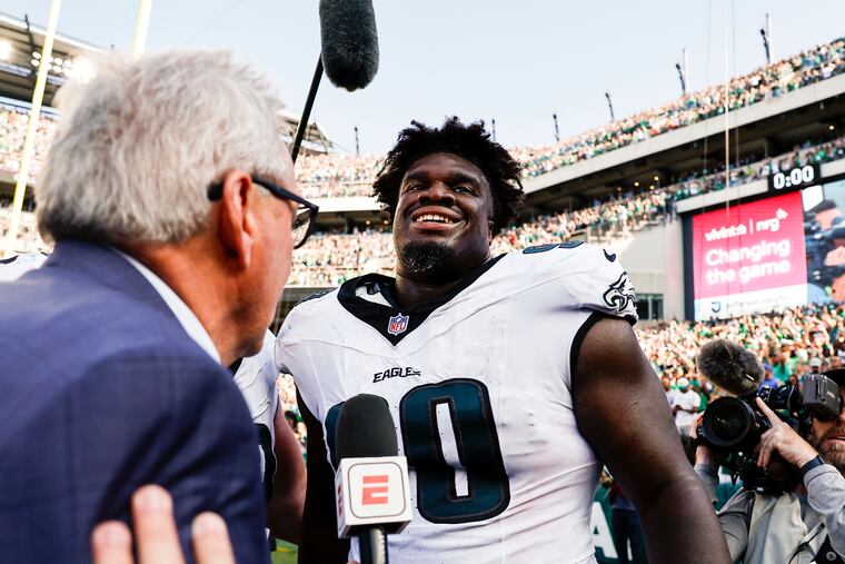 Eagles defensive tackle Jordan Davis is all smiles after blocking a field goal and returning it for a touchdown to seal the Eagles' win over the Rams.