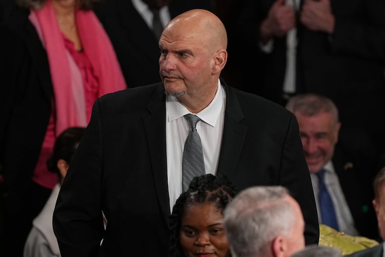 Sen. John Fetterman, D-Pa., arrives before President Donald Trump delivers the State of the Union address to a joint session of Congress in the House chamber at the U.S. Capitol in Washington, Tuesday, Feb. 24, 2026.