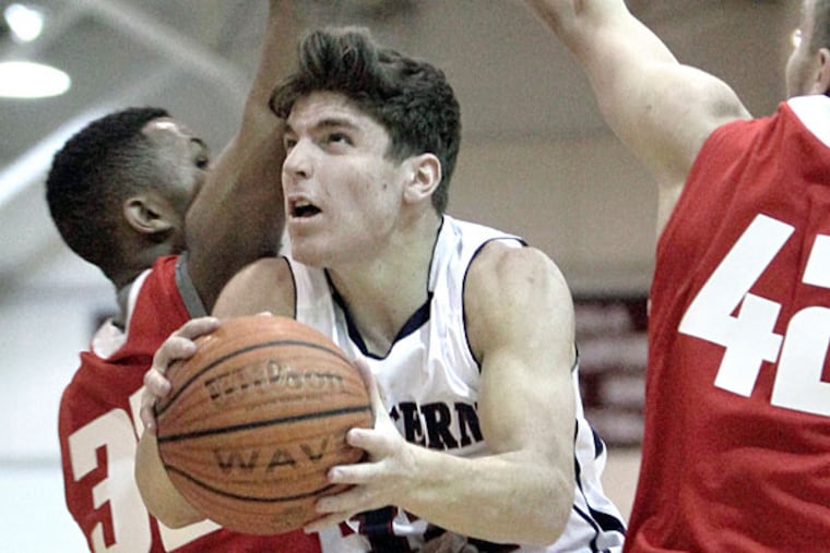 Eastern's # 12 Tom Flacco spits Cherry Hill East's # 33 Timmy Perry
(left) and # 42 Tommy Smierciak on his way to the net in the second
quarter. (Elizabeth Robertson/Staff Photographer)