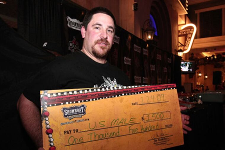 The crawfish champ with check: David "U.S. Male" Goldstein won $1,500 by eating 4.99 pounds of "mudbugs" at Showboat Casino on Feb. 24.
