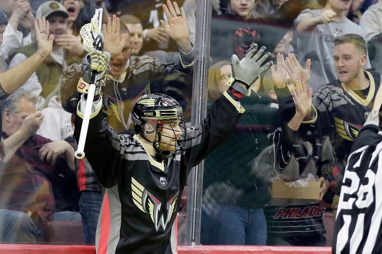 Josh Currier celebrates after scoring for the Wings against the Swarm.