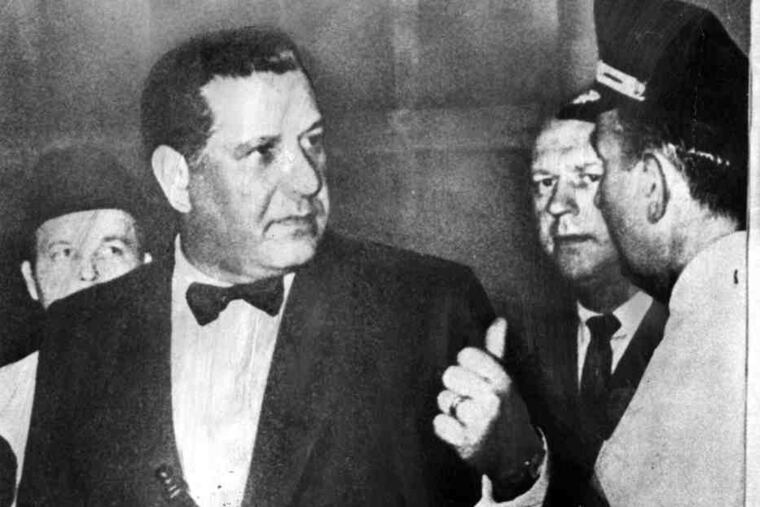 The famous 1969 photo of then-Police Commissioner Frank L. Rizzo in formal dress, with a nightstick in his cummerbund.