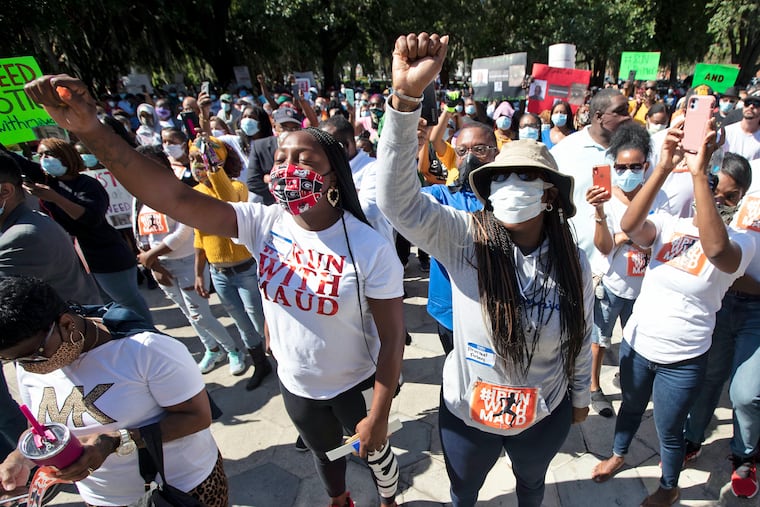 People rallied Friday to protest the shooting of Ahmaud Arbery, an unarmed black man in Brunswick, Ga. John Bazemore/AP